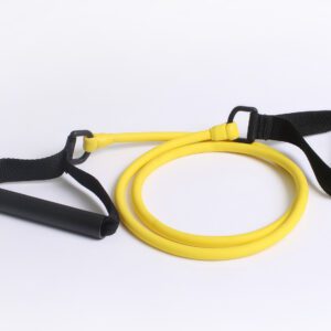A yellow and black resistance band is laying on the floor.