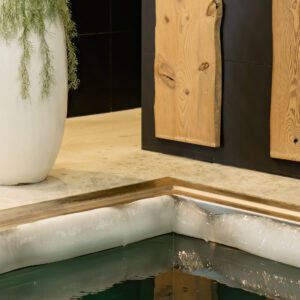 Ice edge on the edge of the plunge bath with very cold water for hardening the body in the sauna complex. Dip in cold water after a hot sauna. Extreme healing of the body with cold water.