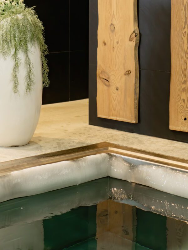 Ice edge on the edge of the plunge bath with very cold water for hardening the body in the sauna complex. Dip in cold water after a hot sauna. Extreme healing of the body with cold water.